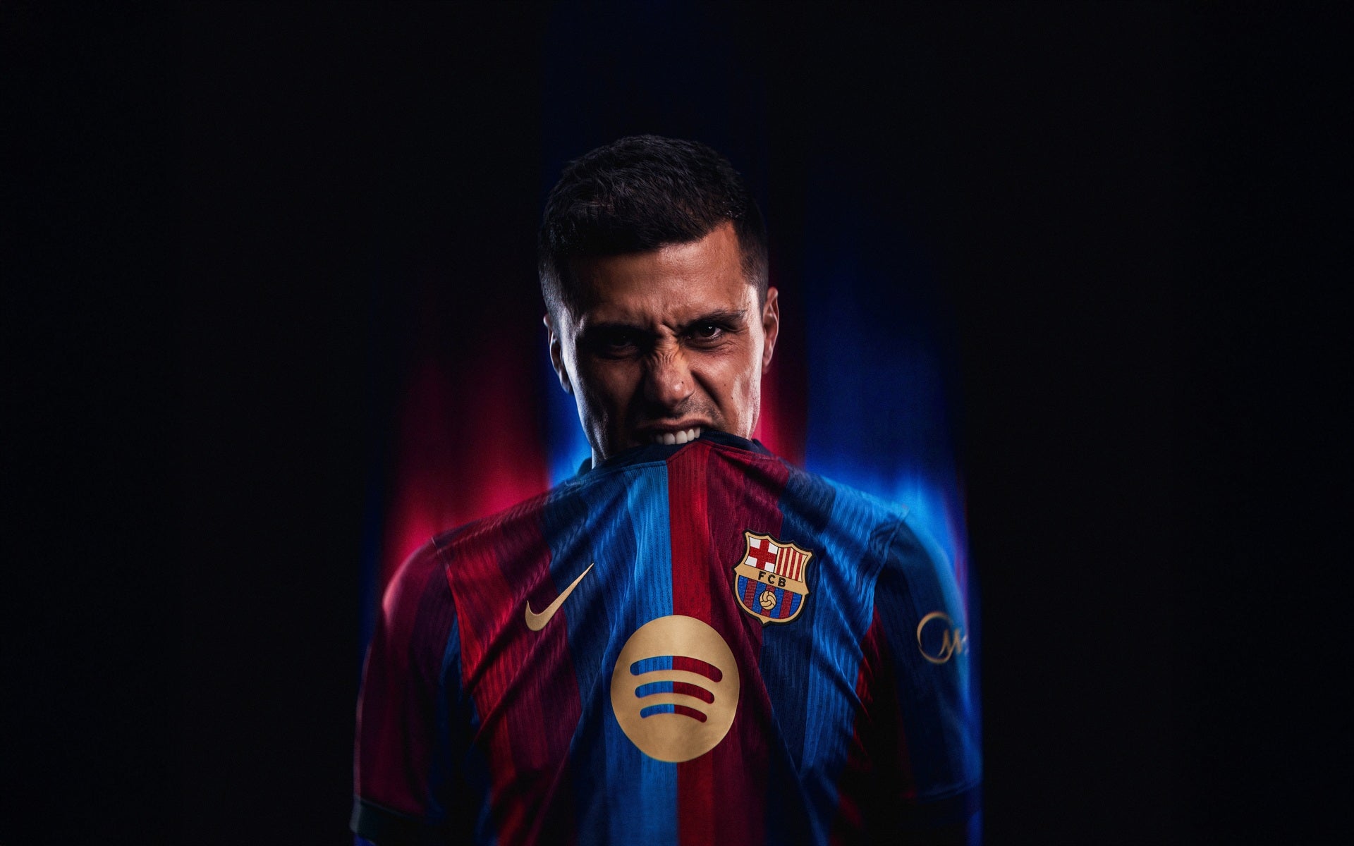 Player biting the badge on his shirt