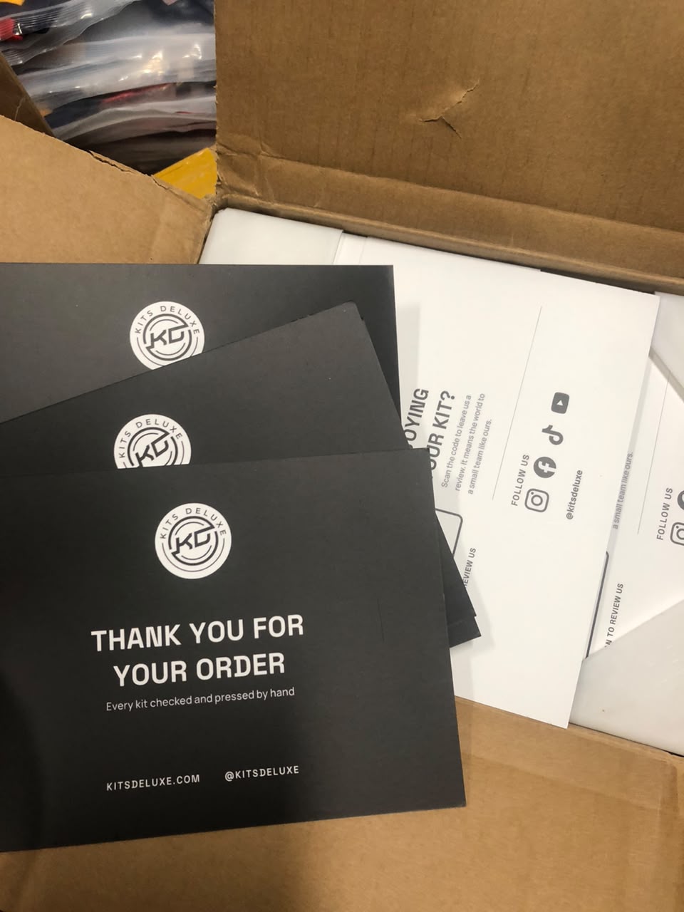 Kits Deluxe thank you cards in a packed order box